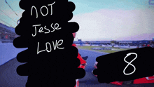 a sign that says " not jesse love " next to a number 8
