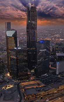 an aerial view of a city with a building that says ' allianz ' on the top