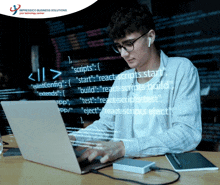 a man is typing on a laptop in front of a screen that says ' impressico business solutions '