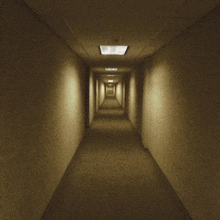a man wearing a mask is walking down a hallway with a gun in his hand
