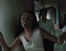 a man and a woman are posing for a picture with mayward written in the corner