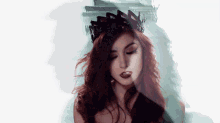 a woman with red hair and a black crown on her head