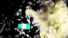 a person is throwing papers in the air with a green box in the middle