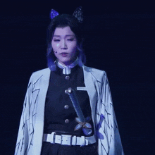 a woman in a costume with a sword on her belt