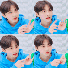 a young boy wearing a blue hoodie is making a heart with his hands
