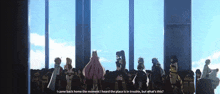 a group of people are standing in front of a window and one of them says i came back home the moment