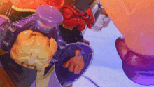 a close up of a toy with a purple and orange item