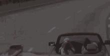 a close up of the front of a semi truck driving down the road .