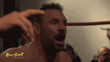 a man with a rebel spirit pro wrestling logo on his face