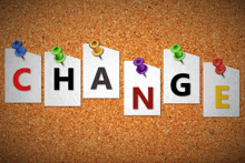 the word change is pinned to a bulletin board