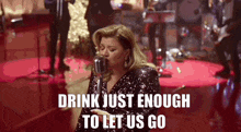 Kelly Clarkson Christmas Isnt Canceled Just You GIF - Kelly Clarkson Christmas Isnt Canceled Just You Drink Just Enough To Let Us Go GIFs