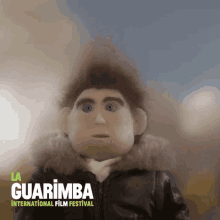 a poster for la guarimba international film festival shows a puppet