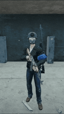 a man wearing a helmet and a mask holds a gun