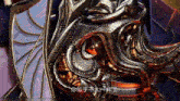 a close up of a metal object with chinese characters on it