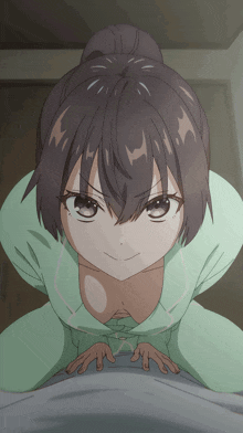 a girl with a bun on her head is kneeling down and looking at the camera