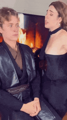 a man and a woman standing next to each other