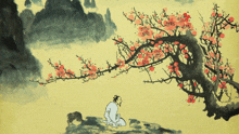 a man sits under a tree with red flowers