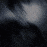 a dark background with a few white lines coming out of it