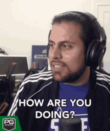 a man wearing headphones and a blue shirt says " how are you doing "