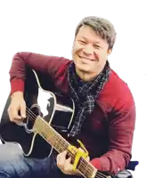 a man in a red sweater is holding a black guitar