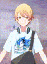 a boy wearing headphones and a white t-shirt with a picture of a bird on it