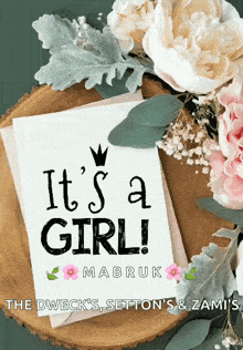 a card that says it 's a girl surrounded by flowers