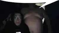 a man without a shirt is talking to a woman