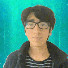 a man wearing glasses and a striped shirt