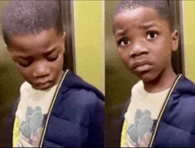 a young boy in an elevator is making a funny face .