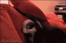 a pixelated image of a person laying on a bed with a 4gifs.com watermark
