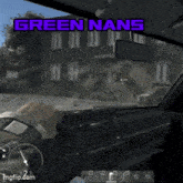 a person playing a video game with the words green nans green nans on the screen