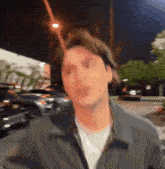 a blurry picture of a man making a funny face