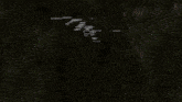 a soccer game is being played in a dark stadium with a banner that says ' fc barcelona ' on it