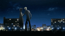 a man stands in front of a city at night