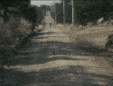 a man in a mask is running on a dirt road