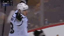 a hockey game is being played between la kings and van