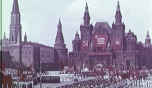 a crowd of people are gathered in front of a large building with a hammer and sickle and star on it