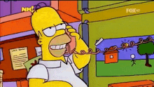 a cartoon of homer simpson talking on a phone with fox hd on the bottom