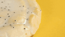 a close up of a slice of cake with a yellow sauce on it