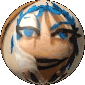 a ball with a face painted on it and blue hair