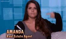 a woman is sitting on a couch with the name amanda real estate agent