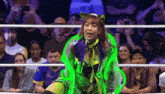 a woman in a wrestling ring with the word aew in the corner