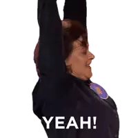 a woman with her arms in the air and the words yeah