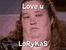 a woman is sitting on a couch with her eyes closed and the words love u lorykas written on her face .