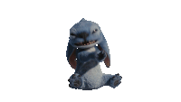 a stuffed animal with its mouth open is sitting down