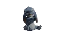 a stuffed animal with its mouth open is sitting down