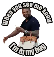 a man holding a purse with the words " when you see me know i 'm in my bag " on the bottom