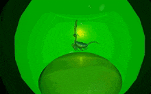a green cartoon scorpion is sitting on a green object