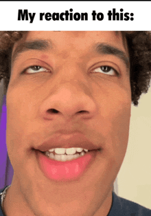 a close up of a man 's face with the words my reaction to this