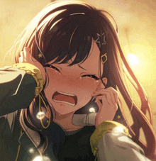 a girl with a star in her hair is crying with her eyes closed